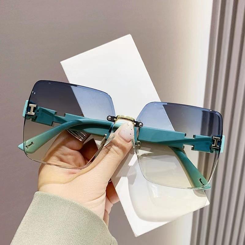 New Trendy Women's Large Frame Slimming Sunglasses Rimless Cut-Edge Sun Protection Sunglasses Influencer Photo High-End Glasses